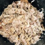 slow cooked pig shoulder that is fully cooked and shredded